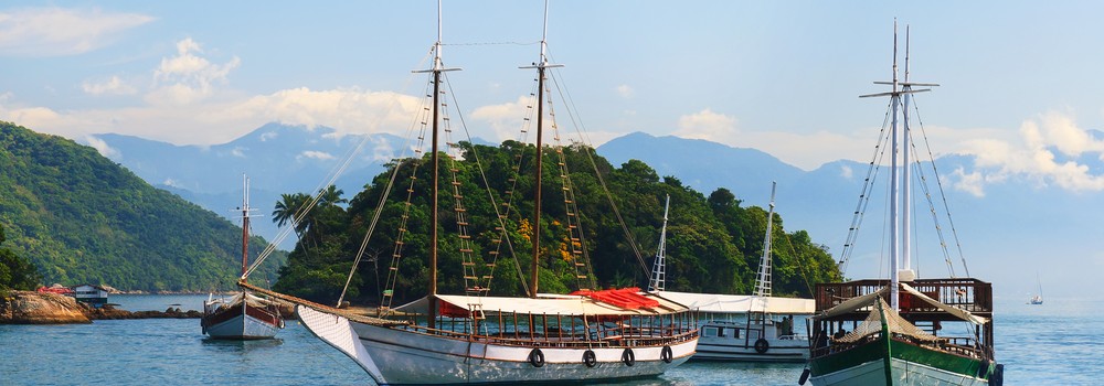 Sailing boats dock up on the shores of Ilha Grande. 