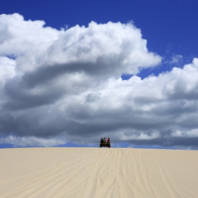 Buggy reaching the top of a dune in Jericoacoara.