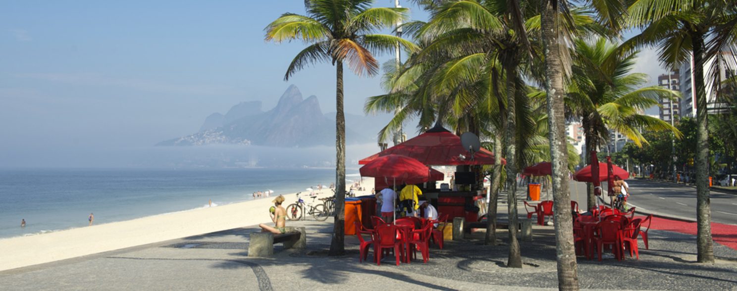 Some people enjoy a sunny day at Ipanema beach in Rio de Janeiro.