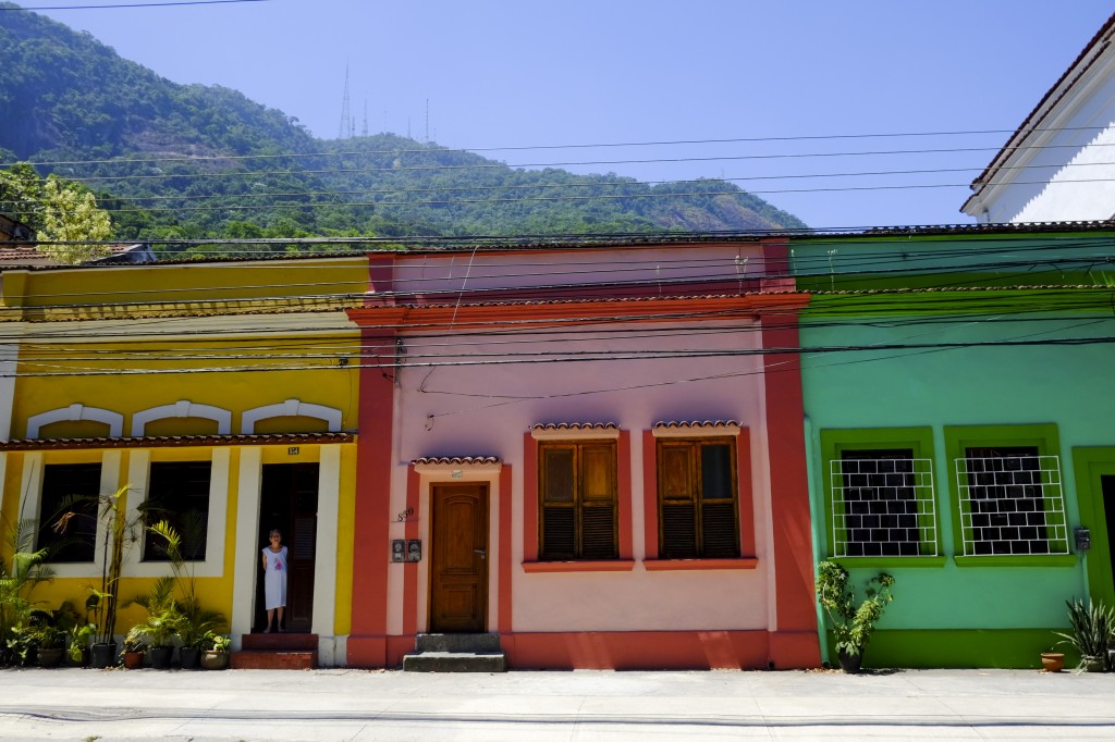 A colourful street in Rio de Janeiro with Tijuca forest in the background. 