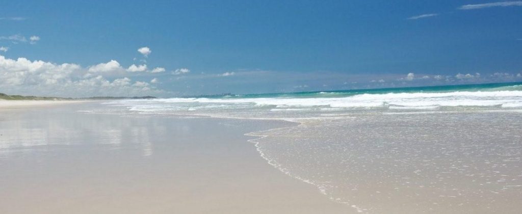 The long shimmering beach at the Kenoa resort. 