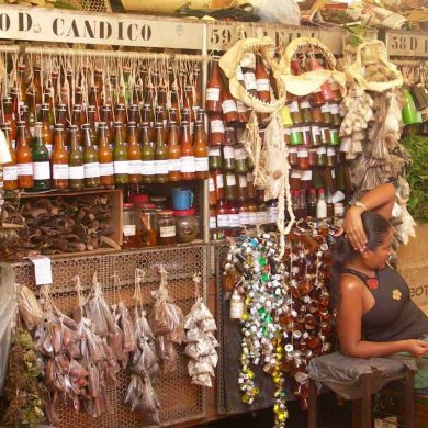Woman sits at her stall at the ver o peso market in Belem.