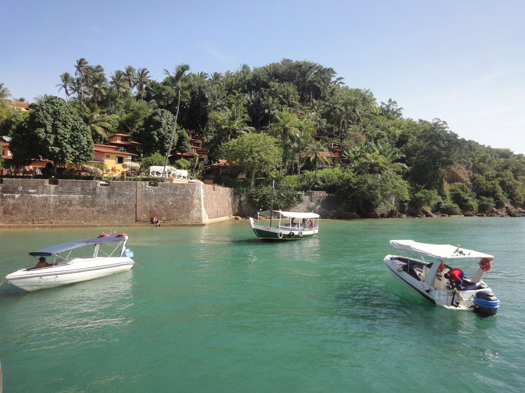 Boats docked on the blue waters of Morro de Sao Paulo.