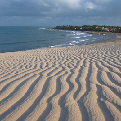 View of Jericoacoara from the top of a big sand dune.