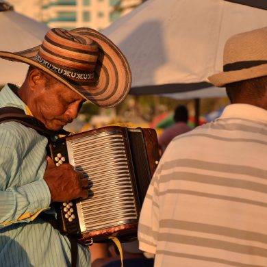 Man plays forro music in the sunset.