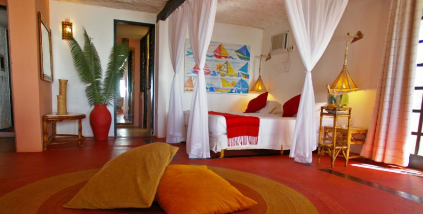 A vibrantly coloured room in the pousada porto da lua in praia do forte. 