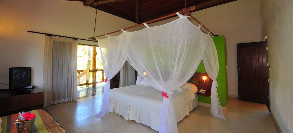 Four - poster bed in the pousada, Vila dos Corais in Morro de São Paulo. 