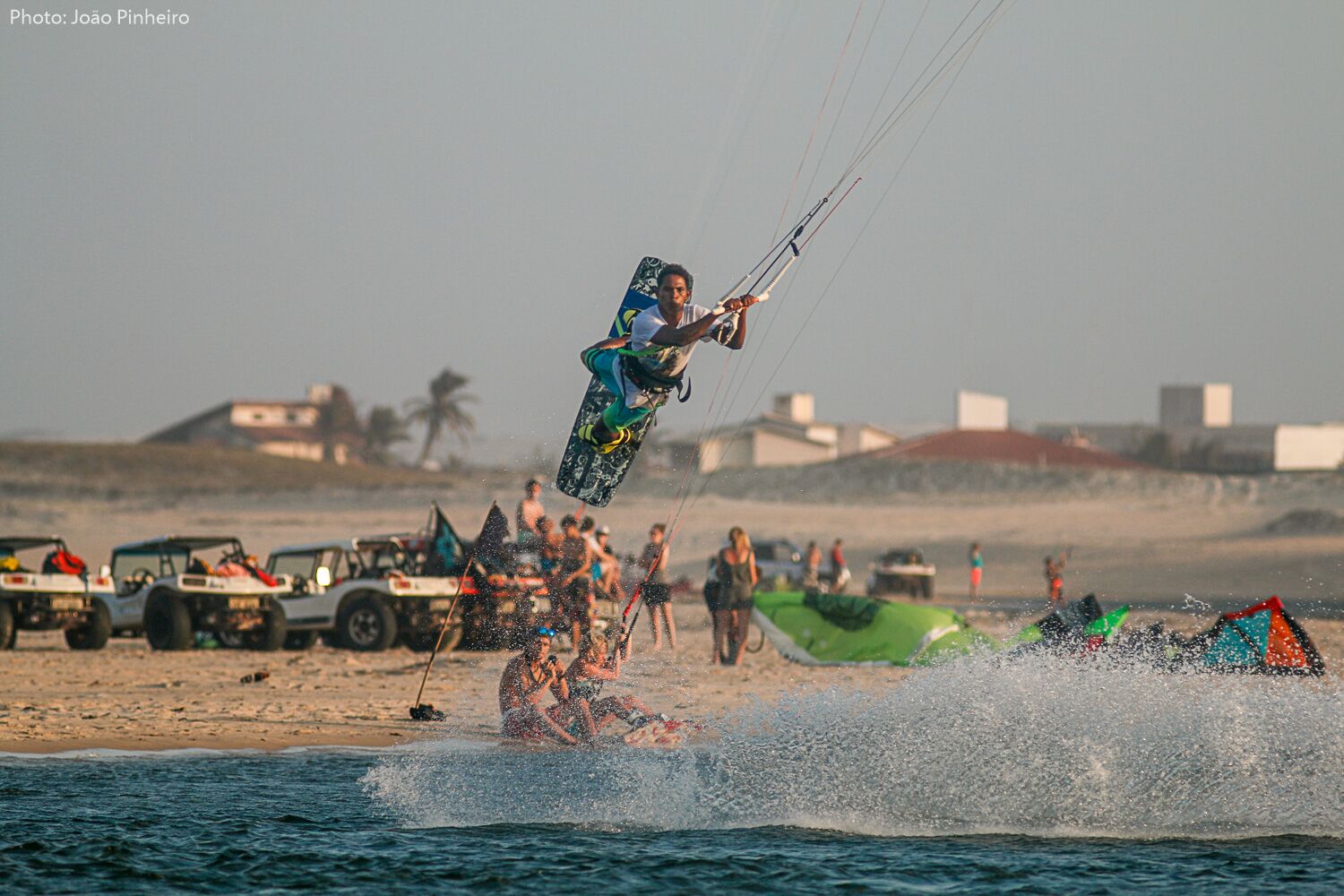 Kitesurfer performing advanced maneuver. 