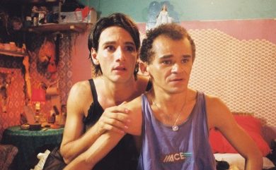 Still shot from film of two men looking scared