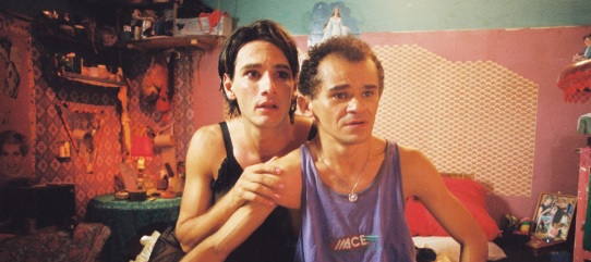 Still shot from film of two men looking scared