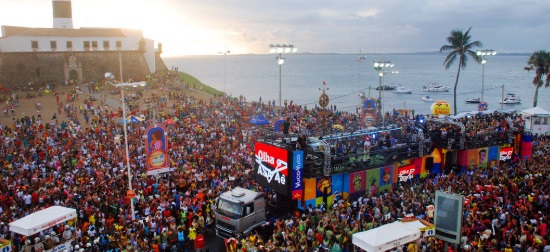 A trio electrico moves through crowd at carnival in Salvador