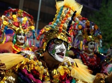 Close-up of dressed up male dancer at carnival.