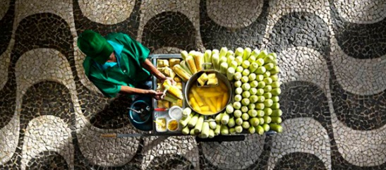 Street vendor sells corn on the cob in Rio.